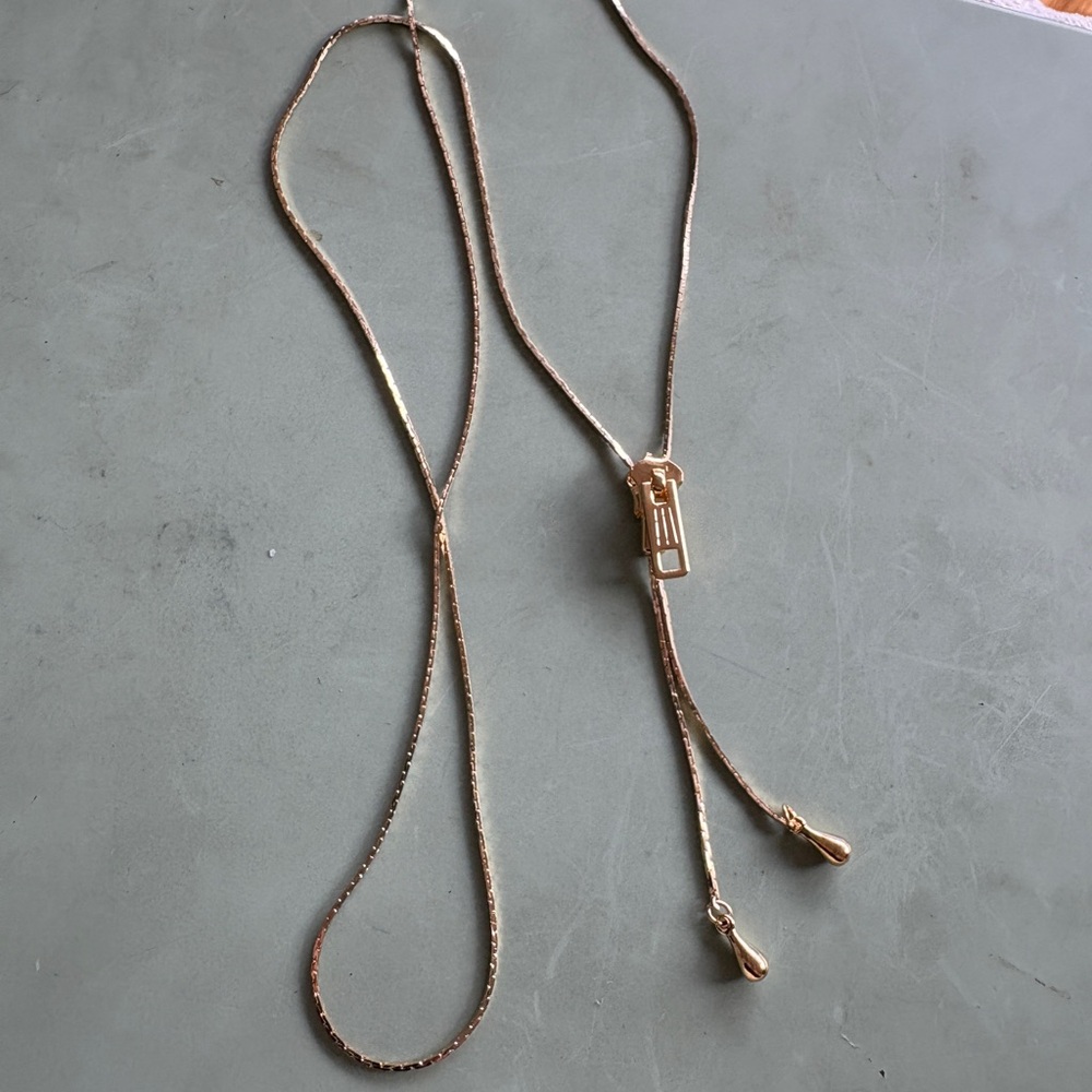 This Vintage Gold Tone Zipper Adjustable Slide Necklace